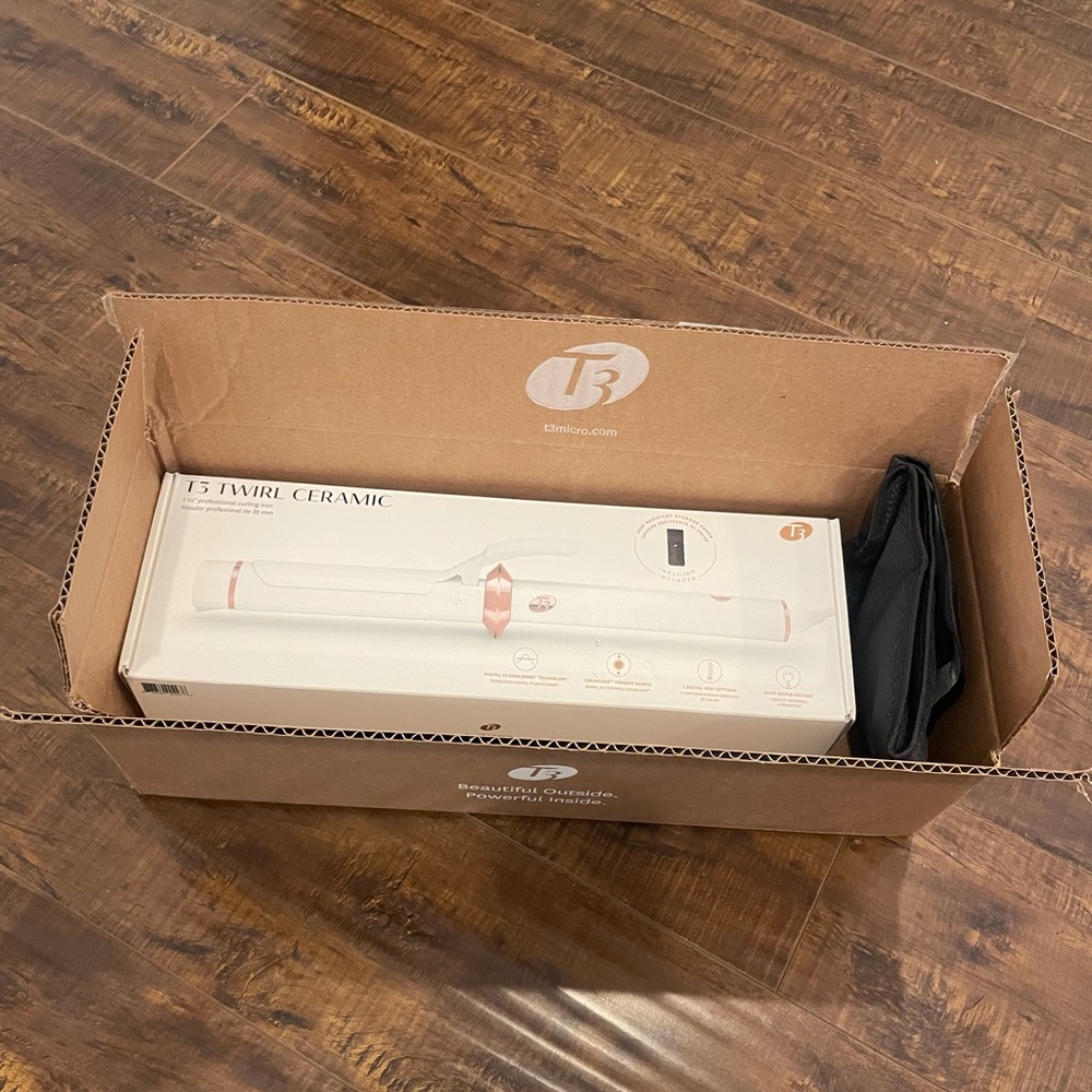 Brand new T3 1 1/4 Twirl Ceramic curling iron with clasp. White and rose gold.